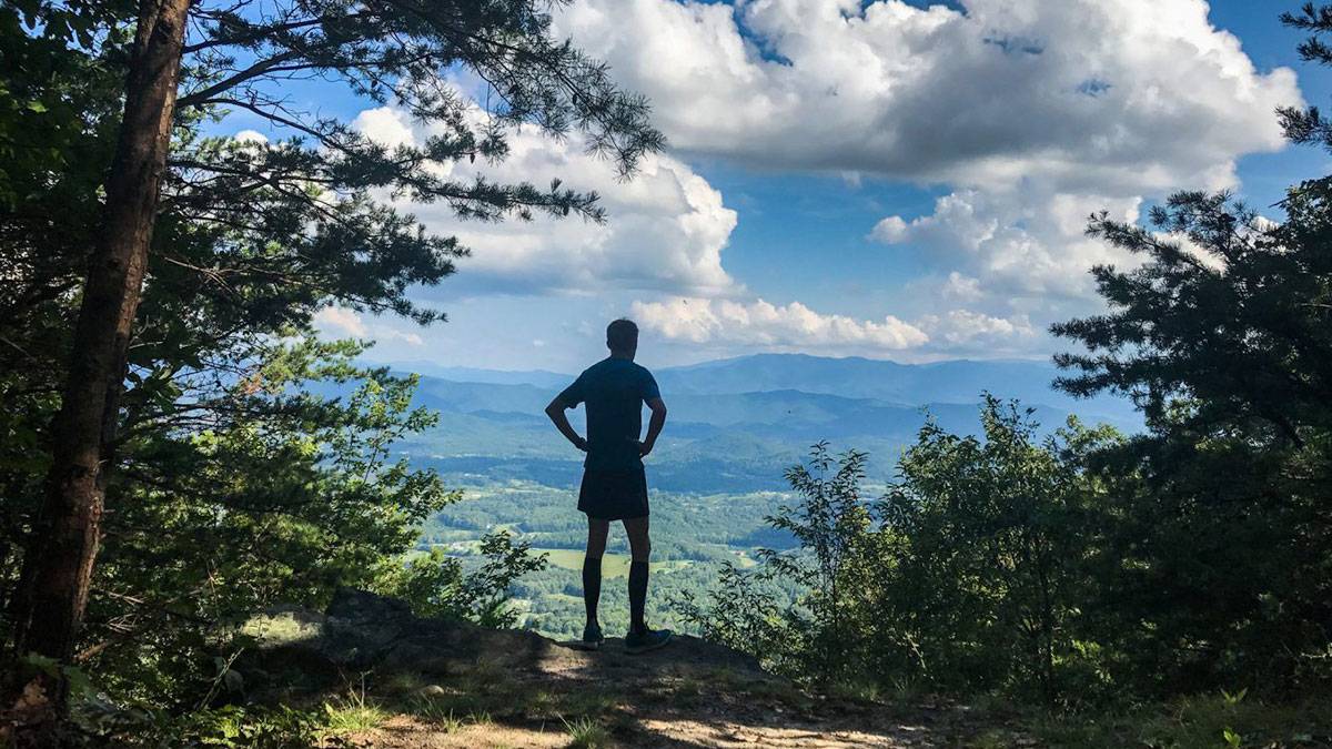 man looking at the smoky mountain view